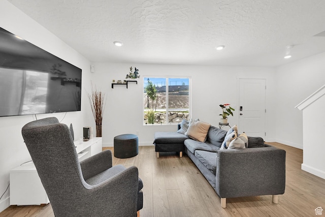 8622 W Cordero Dr S Unit 1170, Magna, UT 84044 - living area with wood finished floors, a textured ceiling, recessed lighting, and baseboards