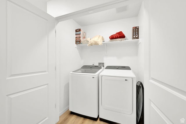 8622 W Cordero Dr S Unit 1170, Magna, UT 84044 - washroom featuring washer and dryer and light wood finished floors