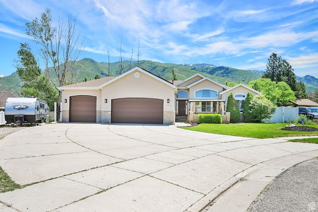 7776 S 2175 E, South Weber, UT 84405 - single story home with a mountain view, concrete driveway, an attached garage, and stucco siding