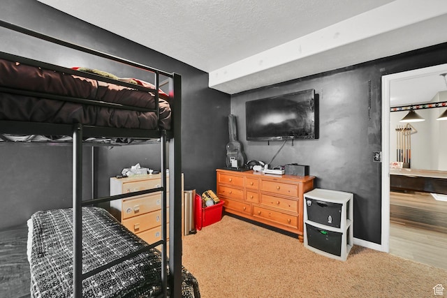 7776 S 2175 E, South Weber, UT 84405 - carpeted bedroom with a textured ceiling, baseboards, and wood finished floors