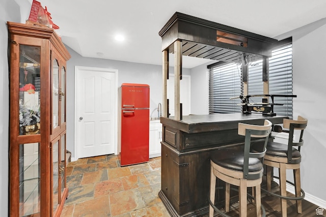 7776 S 2175 E, South Weber, UT 84405 - indoor bar with fridge, baseboards, stone tile flooring, and recessed lighting