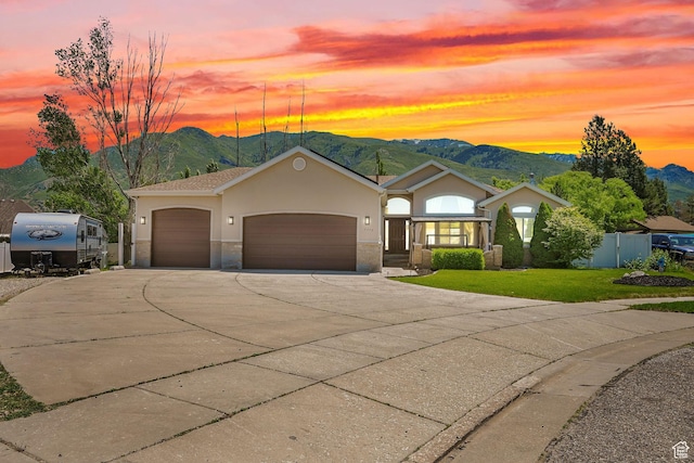 7776 S 2175 E, South Weber, UT 84405 - single story home with driveway, a garage, stucco siding, and a mountain view