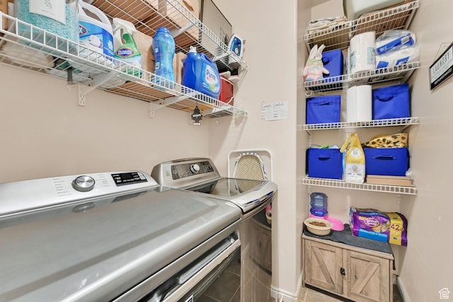 7776 S 2175 E, South Weber, UT 84405 - laundry area featuring washer and dryer and baseboards