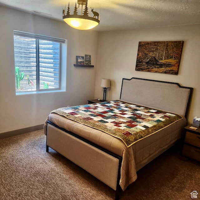 1158 E Ashdown Rd, Cedar City, UT 84721 - bedroom featuring dark carpet and baseboards
