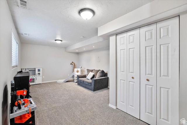 789 W 2005 N, Clinton, UT 84015 - rec room featuring carpet floors, baseboards, and a textured ceiling