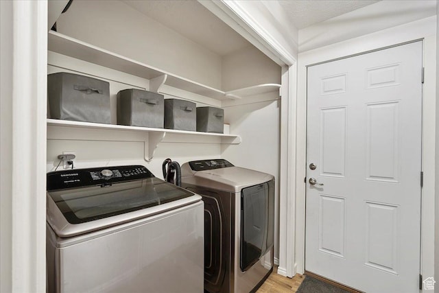 789 W 2005 N, Clinton, UT 84015 - laundry area with washing machine and dryer and light wood-style flooring