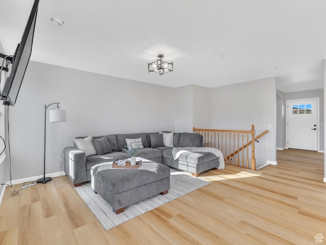 1293 N Buck Run Rd, Rush Valley, UT 84069 - living room featuring wood finished floors, baseboards, and a chandelier