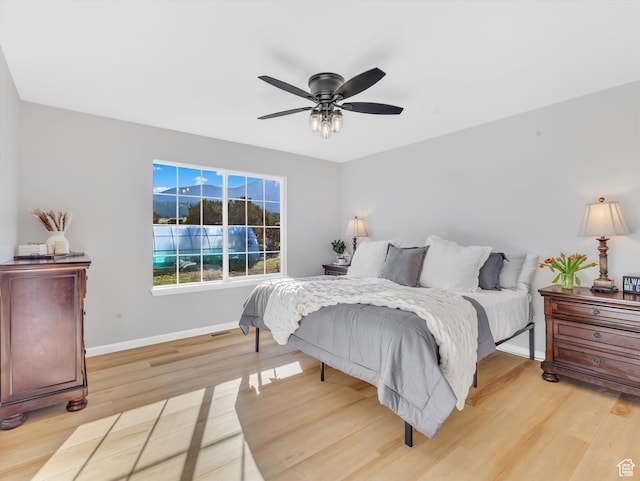 1293 N Buck Run Rd, Rush Valley, UT 84069 - bedroom featuring light wood-type flooring, baseboards, and a ceiling fan