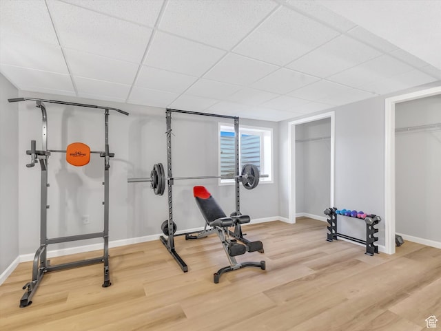 1293 N Buck Run Rd, Rush Valley, UT 84069 - exercise room featuring wood finished floors, baseboards, and a drop ceiling