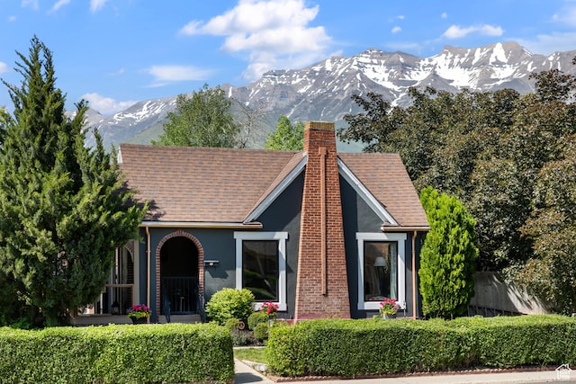 409 E 400 N, Orem, UT 84097 - view of front facade featuring a chimney, a mountain view, stucco siding, and roof with shingles