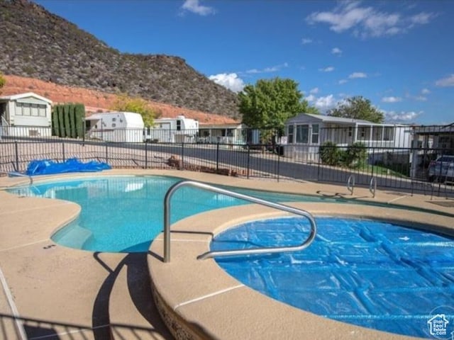 840 N Twin Lakes Dr Unit 127, St George, UT 84770 - community pool featuring a mountain view and a residential view