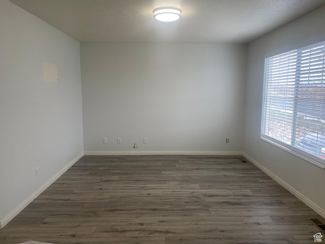 288 N Peach St, Santaquin, UT 84655 - spare room featuring dark wood-type flooring and baseboards