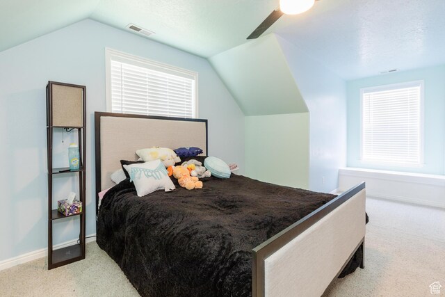 1809 E 1815 N, North Logan, UT 84341 - carpeted bedroom with lofted ceiling, ceiling fan, baseboards, and multiple windows
