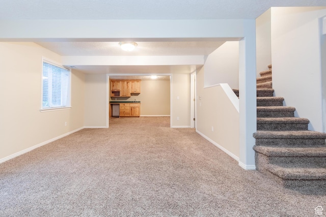 1809 E 1815 N, North Logan, UT 84341 - unfurnished living room with light carpet, stairs, and baseboards