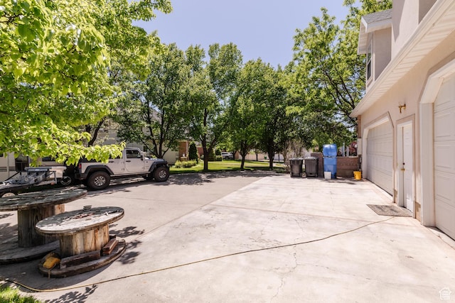 1809 E 1815 N, North Logan, UT 84341 - view of patio featuring driveway and a garage