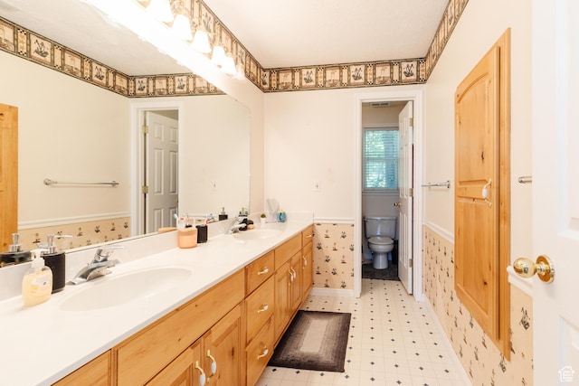 1809 E 1815 N, North Logan, UT 84341 - bathroom with double vanity, tile patterned floors, and toilet