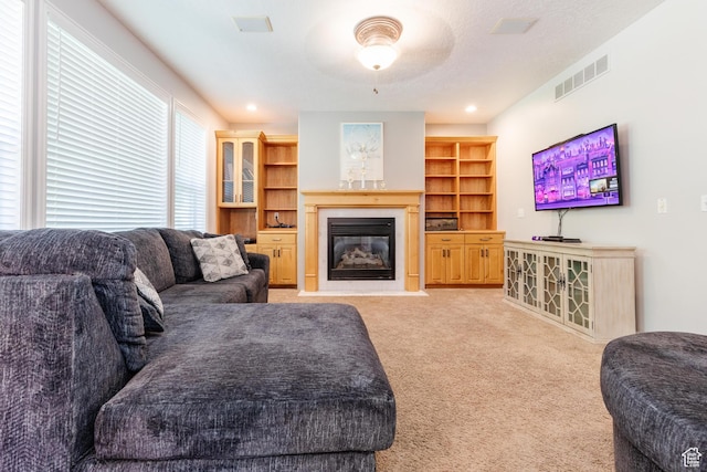 1809 E 1815 N, North Logan, UT 84341 - living room featuring light carpet, a fireplace with flush hearth, and ceiling fan