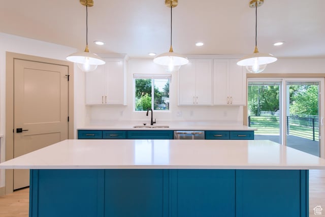 286 E 870 N, Logan, UT 84321 - kitchen with a sink, blue cabinets, light countertops, stainless steel dishwasher, and recessed lighting