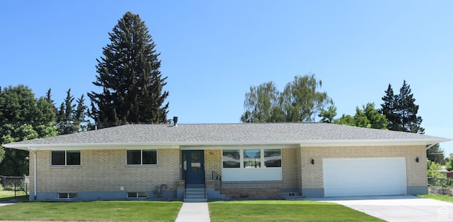 286 E 870 N, Logan, UT 84321 - ranch-style home featuring a front lawn, a garage, brick siding, concrete driveway, and a shingled roof