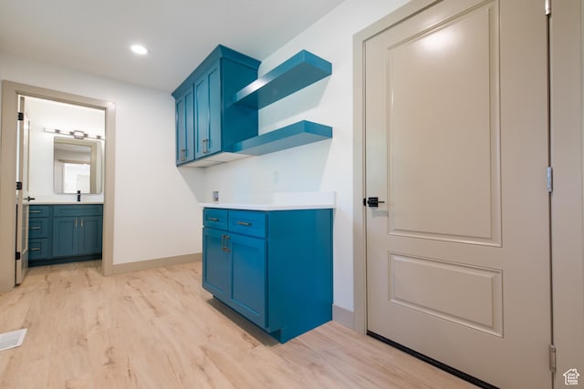 286 E 870 N, Logan, UT 84321 - laundry room with light wood finished floors, baseboards, and recessed lighting