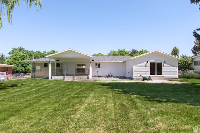 286 E 870 N, Logan, UT 84321 - rear view of property featuring entry steps, a lawn, and a porch