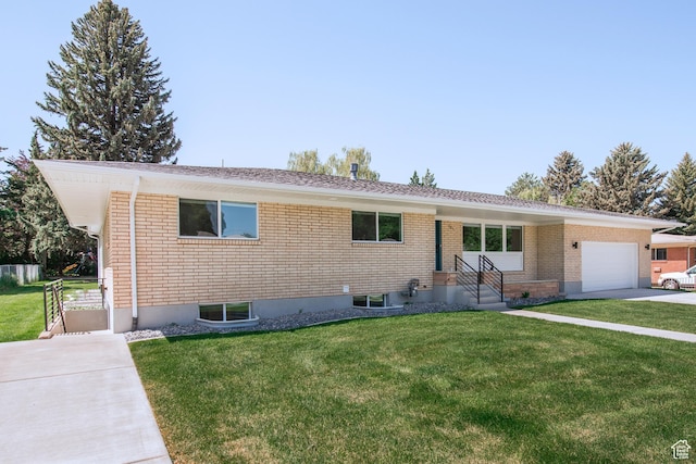 286 E 870 N, Logan, UT 84321 - ranch-style home featuring a front lawn, an attached garage, brick siding, and entry steps