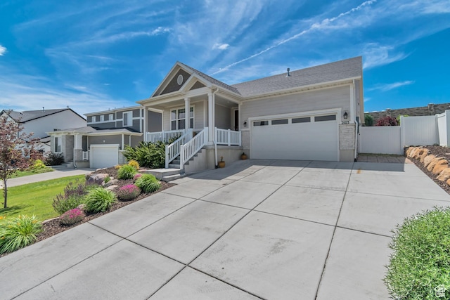 2103 N Elderberry Dr W Unit 222, Saratoga Springs, UT 84045 - ranch-style home with driveway, a garage, and covered porch