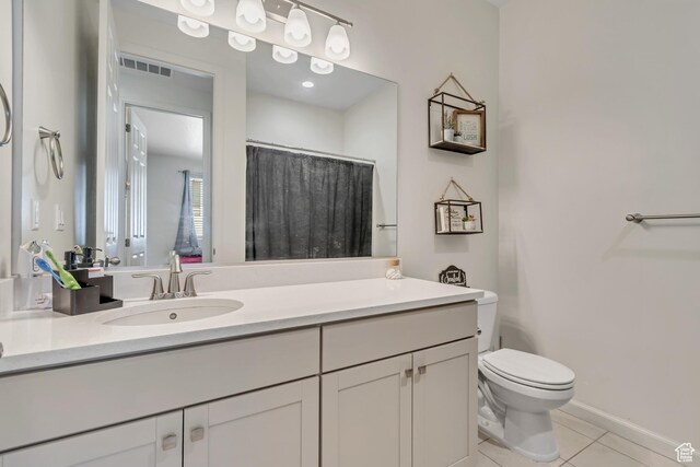 2103 N Elderberry Dr W Unit 222, Saratoga Springs, UT 84045 - full bathroom with toilet, tile patterned flooring, vanity, and a shower with curtain