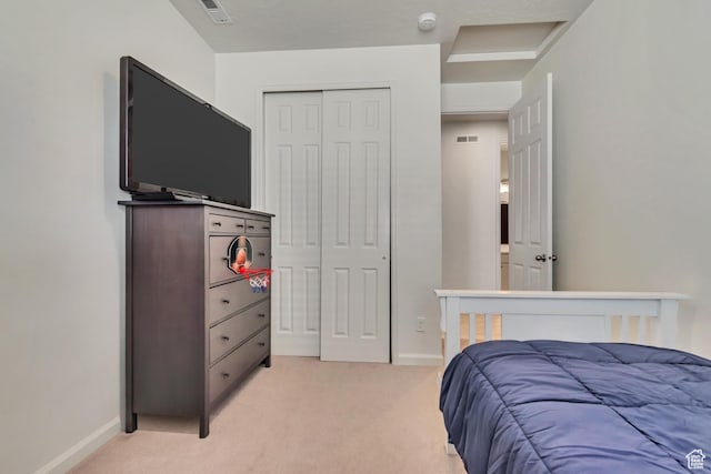 2103 N Elderberry Dr W Unit 222, Saratoga Springs, UT 84045 - bedroom featuring light colored carpet, a closet, and baseboards