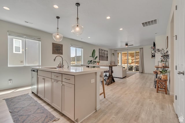 2103 N Elderberry Dr W Unit 222, Saratoga Springs, UT 84045 - kitchen featuring a sink, a center island with sink, dishwasher, healthy amount of natural light, and recessed lighting