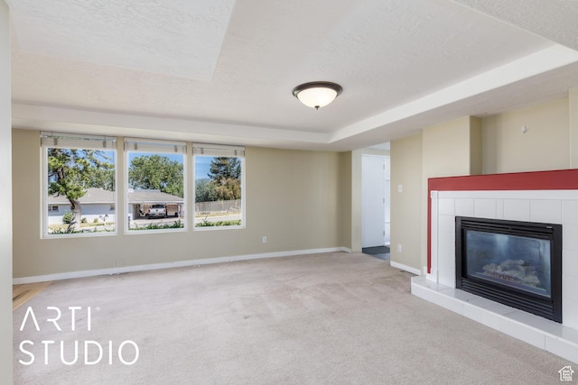 162 E 3000 S, Bountiful, UT 84010 - unfurnished living room featuring a textured ceiling, carpet flooring, a tile fireplace, baseboards, and a raised ceiling
