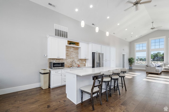 261 E Sage Canal Way, Sandy, UT 84070 - kitchen with stainless steel appliances, ceiling fan, high vaulted ceiling, a sink, and a kitchen island
