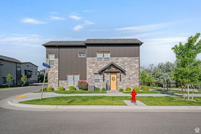 261 E Sage Canal Way, Sandy, UT 84070 - modern home featuring stone siding, cooling unit, a shingled roof, and a front yard