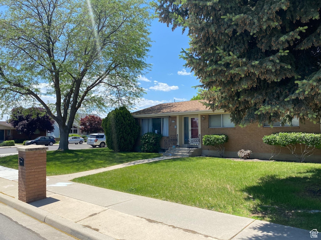 1031 N 1750 W, Provo, UT 84604 - view of front facade featuring a front lawn and brick siding