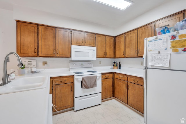 1031 N 1750 W, Provo, UT 84604 - kitchen featuring white appliances, brown cabinets, light flooring, and light countertops