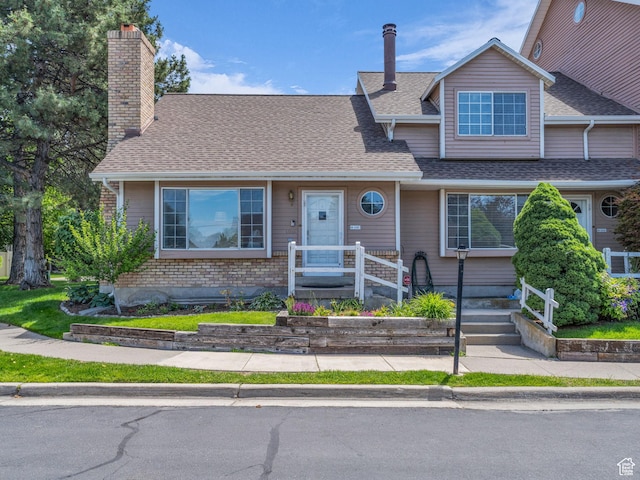 648 E 6870 S, Midvale, UT 84047 - view of front of home featuring a chimney and roof with shingles