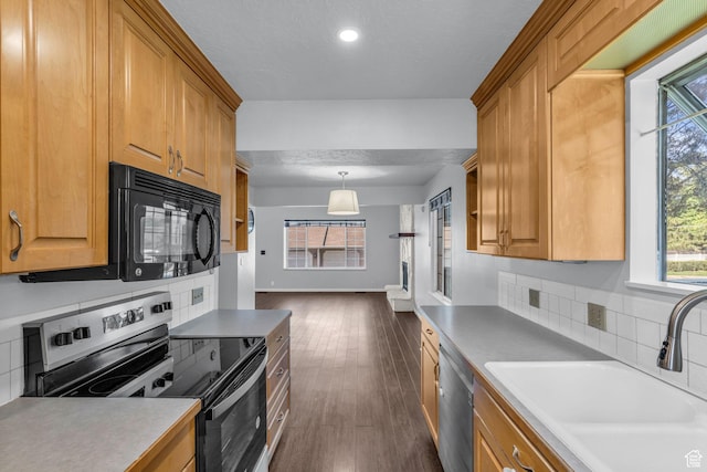 648 E 6870 S, Midvale, UT 84047 - kitchen with appliances with stainless steel finishes, a sink, dark wood-style flooring, recessed lighting, and hanging light fixtures