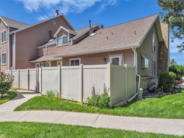 648 E 6870 S, Midvale, UT 84047 - view of side of home with a shingled roof and a chimney