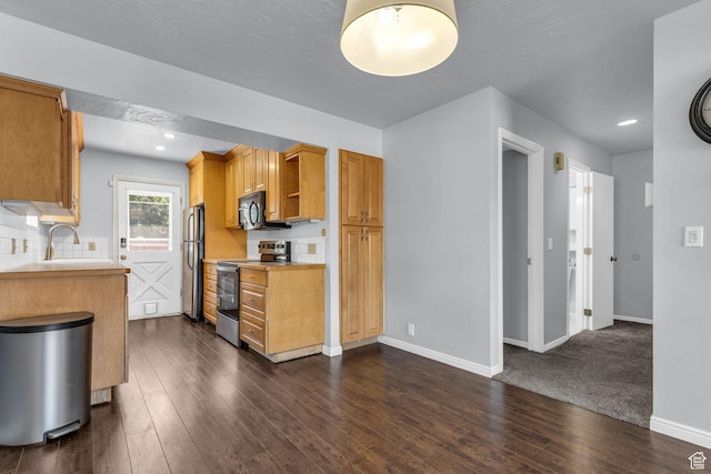 648 E 6870 S, Midvale, UT 84047 - kitchen featuring appliances with stainless steel finishes, light countertops, baseboards, dark wood-style flooring, and recessed lighting