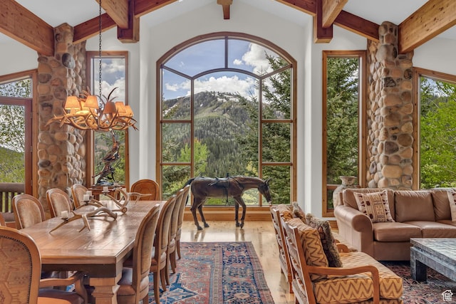 9968 Summit View Dr, Heber City, UT 84032 - sunroom with a chandelier, beam ceiling, and a mountain view