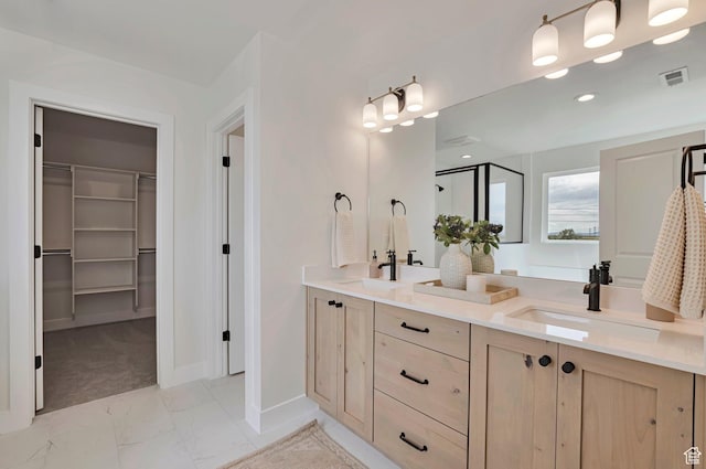 2131 N 725 W, Centerville, UT 84014 - full bath featuring a spacious closet, double vanity, marble look tile flooring, a shower stall, and recessed lighting