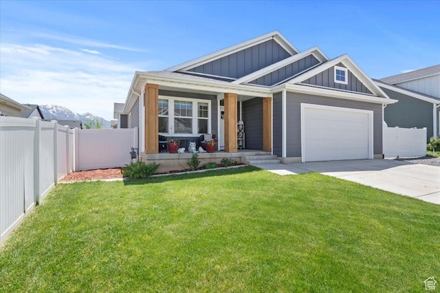 116 E 970 N, Santaquin, UT 84655 - view of front of home with board and batten siding, covered porch, concrete driveway, and a garage