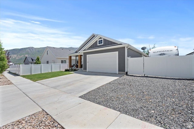 116 E 970 N, Santaquin, UT 84655 - ranch-style home with driveway, board and batten siding, an attached garage, and a mountain view