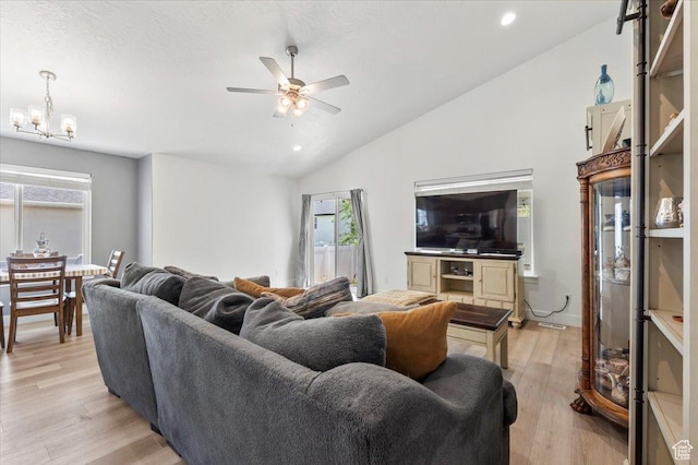 116 E 970 N, Santaquin, UT 84655 - living room with vaulted ceiling, ceiling fan, healthy amount of natural light, light wood finished floors, and a chandelier