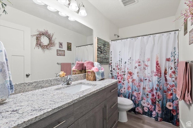 116 E 970 N, Santaquin, UT 84655 - bathroom featuring wood finished floors, vanity, toilet, curtained shower, and a chandelier