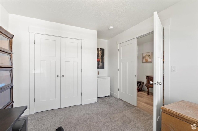 116 E 970 N, Santaquin, UT 84655 - bedroom featuring light carpet, a closet, a textured ceiling, and baseboards