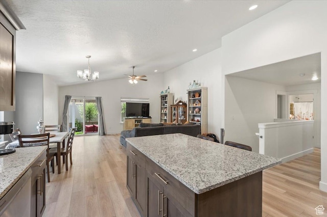 116 E 970 N, Santaquin, UT 84655 - kitchen featuring vaulted ceiling, a chandelier, light wood-style flooring, a ceiling fan, and dark brown cabinetry