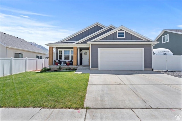 116 E 970 N, Santaquin, UT 84655 - view of front of property with board and batten siding, driveway, an attached garage, and covered porch
