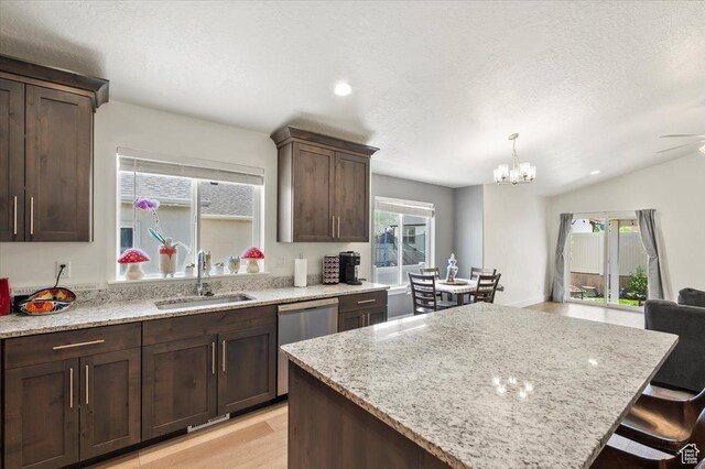 116 E 970 N, Santaquin, UT 84655 - kitchen with a sink, dishwasher, a center island, dark brown cabinets, and light stone counters