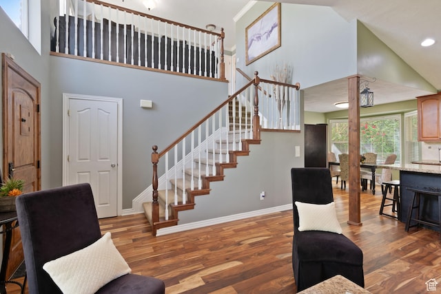 468 E Brewster, Draper, UT 84020 - living area with high vaulted ceiling, stairway, wood finished floors, and baseboards
